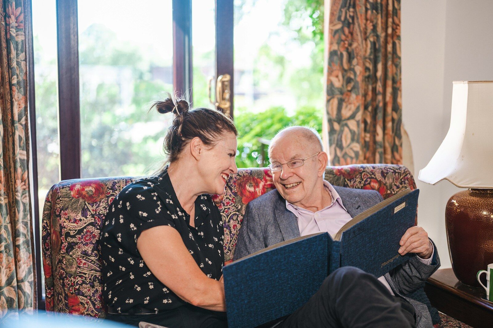 a man and a woman sitting on a couch